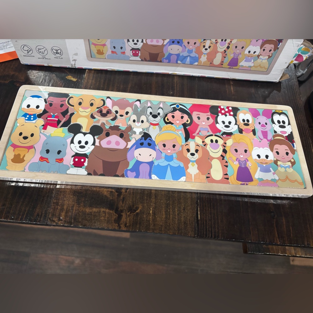 Wooden Disney puzzle, brand new condition plastic still on and puzzle never used